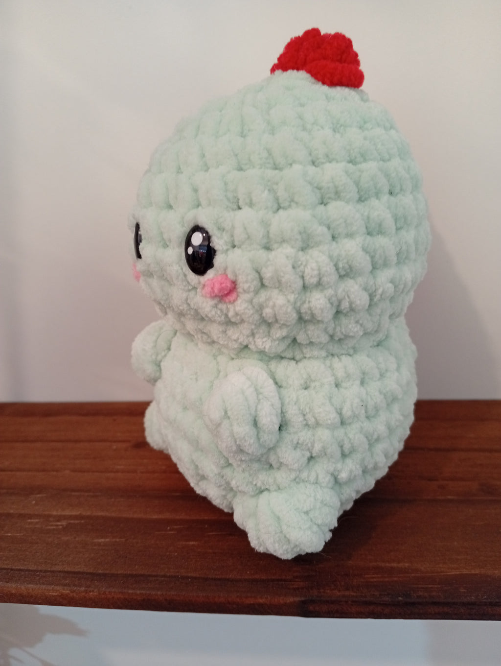 DINO ADORABLE VERDE CON ESCAMAS ROJAS